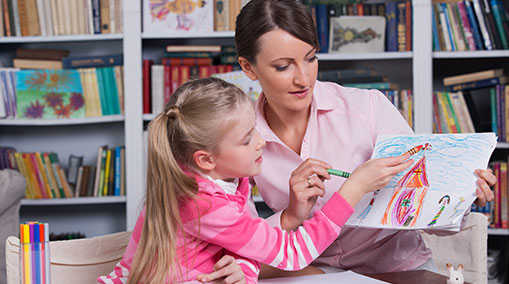 a child and a therapist interact during child therapy